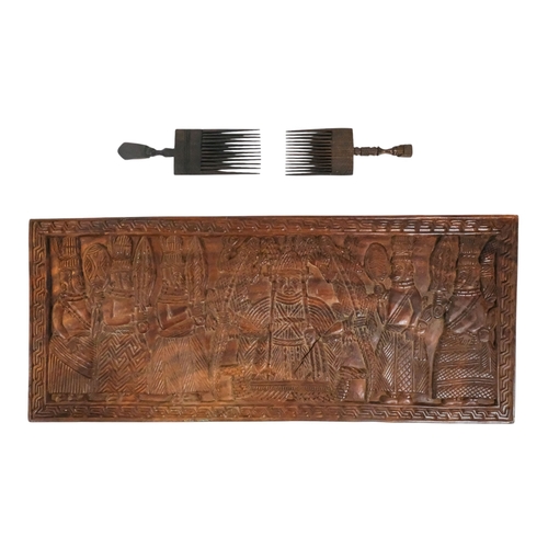 116 - Two African hardwood combs - each carved with a head to the handle, together with a rectangular carv... 