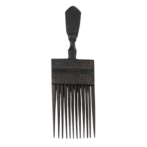116 - Two African hardwood combs - each carved with a head to the handle, together with a rectangular carv... 
