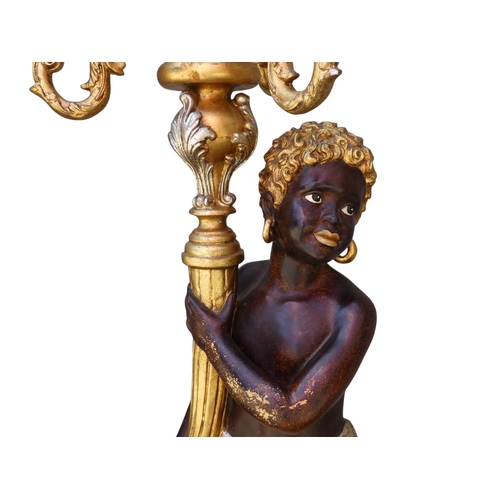 118 - A pair of Blackamoor lamps - gilded and polychrome painted, the figures holding multi-lamp torches, ... 