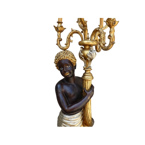 118 - A pair of Blackamoor lamps - gilded and polychrome painted, the figures holding multi-lamp torches, ... 