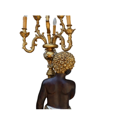 118 - A pair of Blackamoor lamps - gilded and polychrome painted, the figures holding multi-lamp torches, ... 