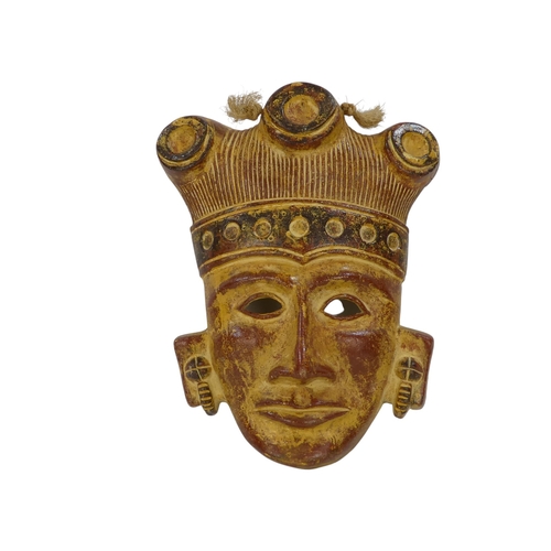 143 - A terracotta figure of an Aztec warrior - holding shield and club, 36cm high, together with an Aztec... 