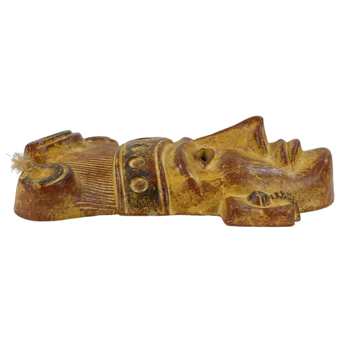 143 - A terracotta figure of an Aztec warrior - holding shield and club, 36cm high, together with an Aztec... 