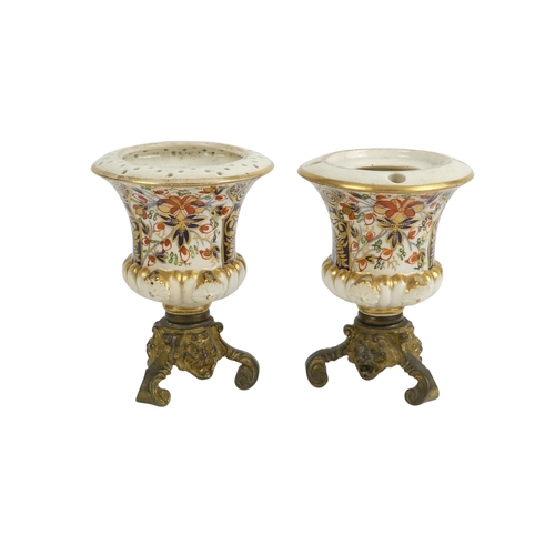 202 - A pair of Royal Crown Derby jugs - of squat form and decorated in the Imari style, marks to base, 13... 