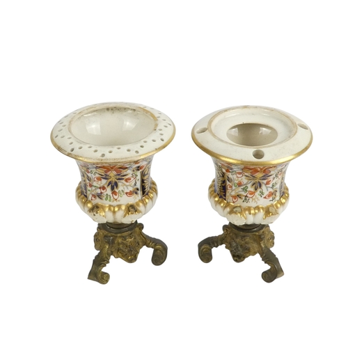 202 - A pair of Royal Crown Derby jugs - of squat form and decorated in the Imari style, marks to base, 13... 