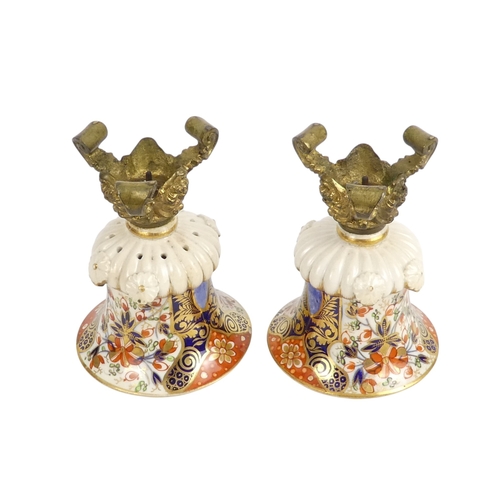 202 - A pair of Royal Crown Derby jugs - of squat form and decorated in the Imari style, marks to base, 13... 