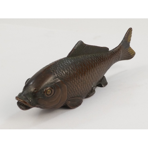 41 - A cast metal carp - with a bronzed finish, 9cm long.