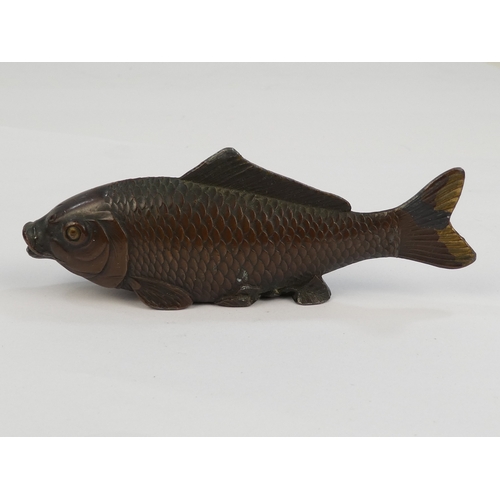 41 - A cast metal carp - with a bronzed finish, 9cm long.