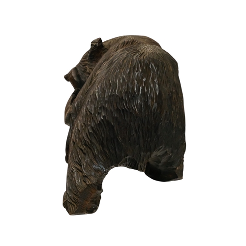 57 - A Black Forest model of a bear with a salmon - width 38cm, height 25cm.