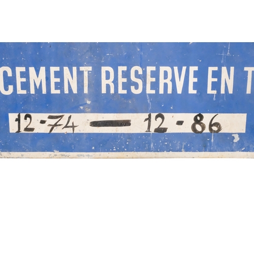 65 - A 20th century French parking restrictions sign - white sans-serif script on a blue ground, 33 x 68c... 