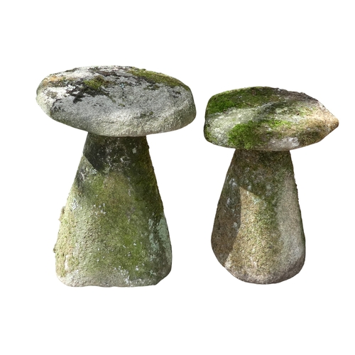 68 - Two granite staddle stones - with domed tops and circular tapering bases, one 67cm high, the other 6... 