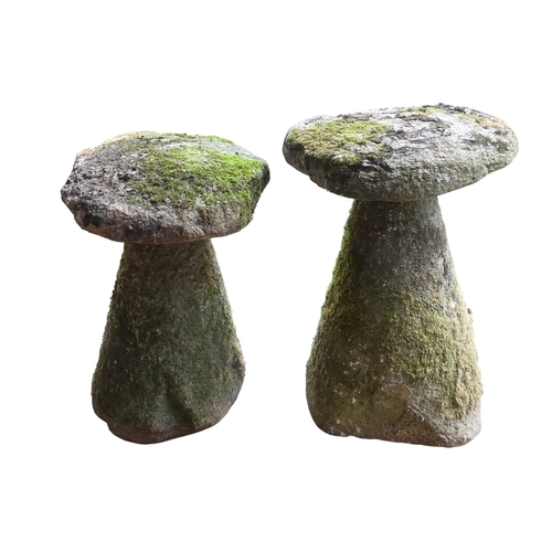68 - Two granite staddle stones - with domed tops and circular tapering bases, one 67cm high, the other 6... 