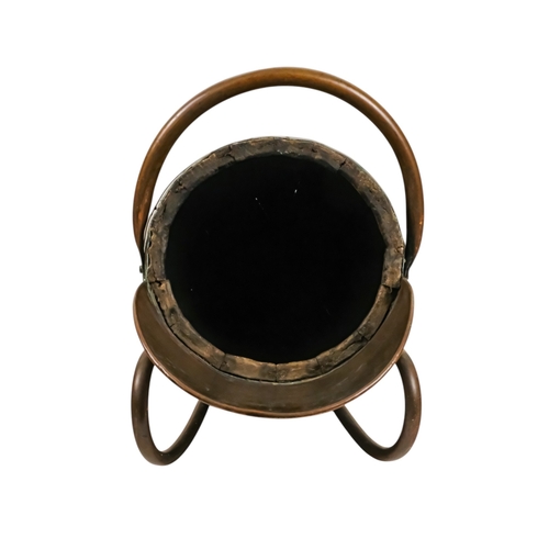 69 - A staved barrel/bucket with copper bindings, handles and lip - diameter 23cm, height 54cm.
