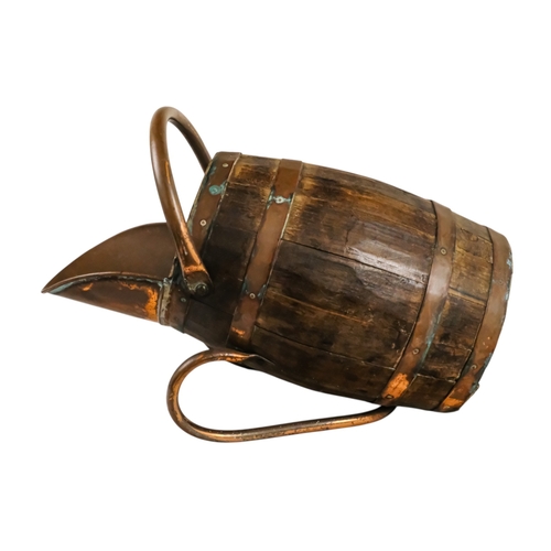 69 - A staved barrel/bucket with copper bindings, handles and lip - diameter 23cm, height 54cm.