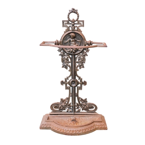 70 - A Victorian cast iron umbrella stand - decorated with a putti upon fruit, width 39cm, height 74cm.