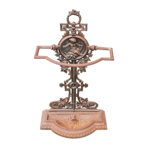 70 - A Victorian cast iron umbrella stand - decorated with a putti upon fruit, width 39cm, height 74cm.