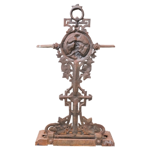 70 - A Victorian cast iron umbrella stand - decorated with a putti upon fruit, width 39cm, height 74cm.