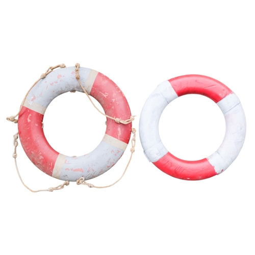 71 - A life buoy ring with red and white decoration and rope grab lines - diameter 74cm, together with an... 