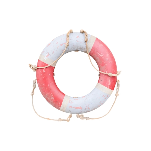 71 - A life buoy ring with red and white decoration and rope grab lines - diameter 74cm, together with an... 