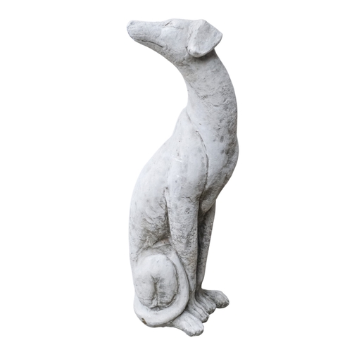 72 - A pair of reconstituted stone whippets - heads looking back, height 55cm.