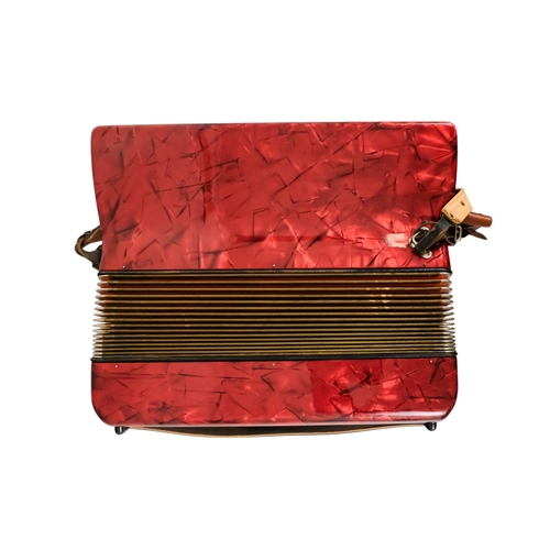 74 - A Hohner piano accordion - Carena IIIM, with a red marbled case and a grey carry case.