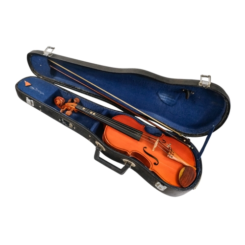 81 - A child's violin, length of back 31cm - with box, cased.