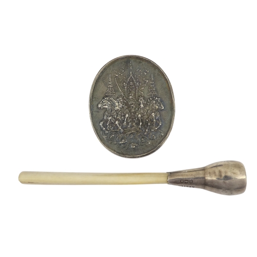 90 - A Thai royal commemorative white metal token - oval decorated with horses and script verso, together... 