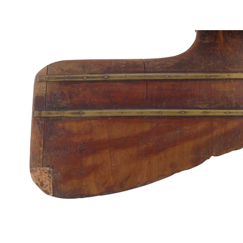 92 - A mahogany skiff rudder - with brass binding and copper patches, 40cm.