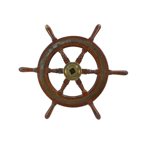 93 - A late 19th century teak ship's wheel - with brass binding, hub and brass tipped handle to top, 63cm... 