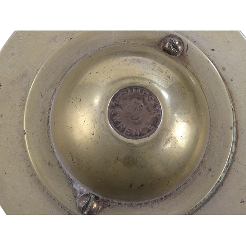 94 - A teak ship's wheel by Simpson & Lawrence - with brass binding and hub, 63cm diameter.