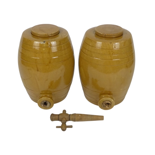 95 - A pair of treacle glazed barrels - cast with bands and a loose cover, 27cm high. (2)