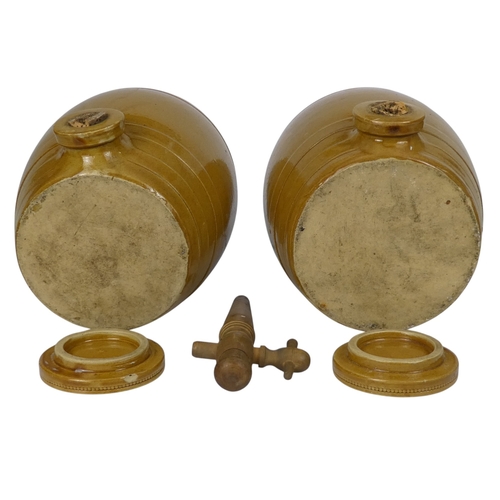 95 - A pair of treacle glazed barrels - cast with bands and a loose cover, 27cm high. (2)