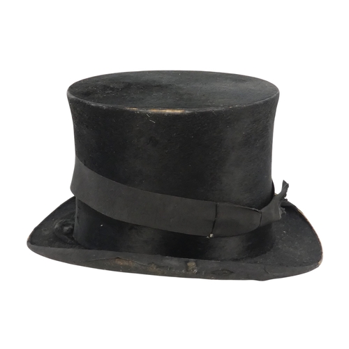 97 - A late 19th century top hat - marked 6 3/4, within a black japanned tin hat box.