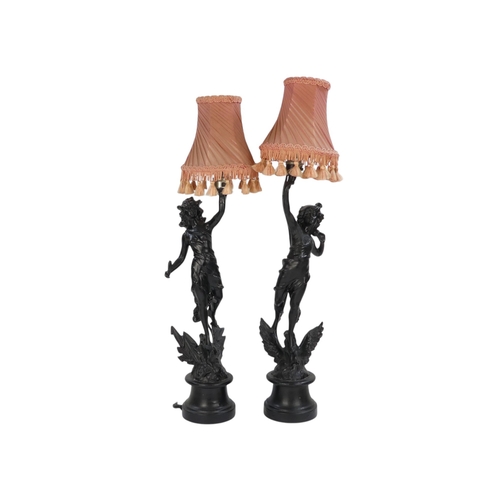 98 - A pair of spelter table lamps - modelled as classical emblematic of The Graces, 57cm high.