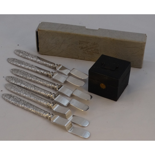 99 - A Victorian travelling inkwell - square black leather clad with a bail handle to the cover, 4cm wide... 