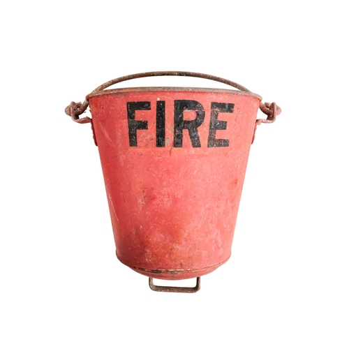 122 - A pair of red painted galvanised fire buckets - stencilled 'Fire', with swing handles and additional... 