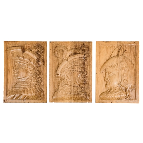 127 - A group of six 15th century style carved oak panels  - decorated with pseudo family coats of arms, 1... 