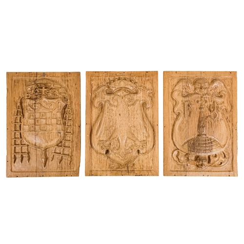 127 - A group of six 15th century style carved oak panels  - decorated with pseudo family coats of arms, 1... 