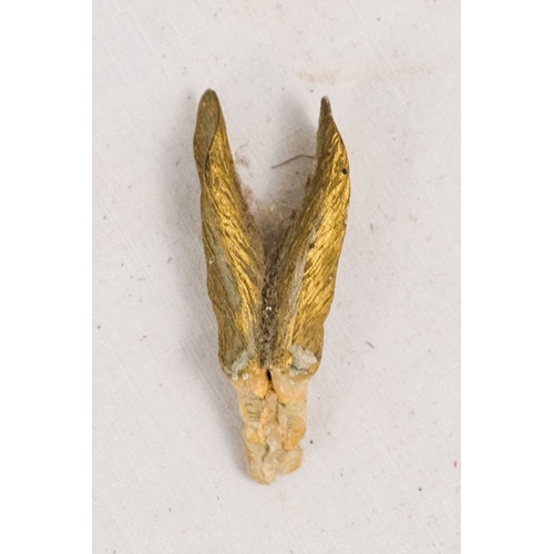 142 - An early 20th century white silk parasol - the green painted handle terminating in a carved rabbits ... 