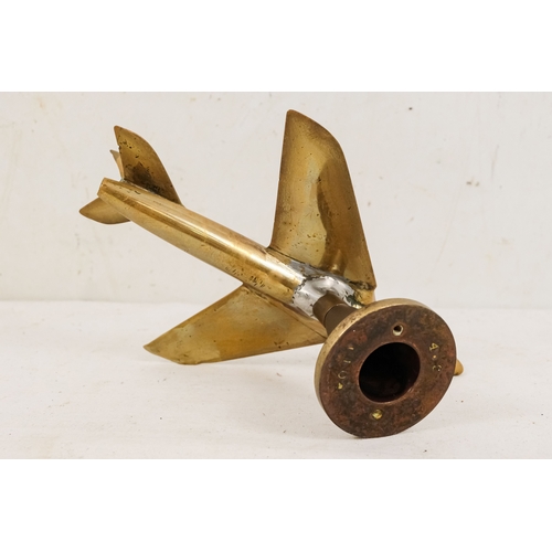 144 - A brass aeroplane mascot - height 15cm, length 20cm.