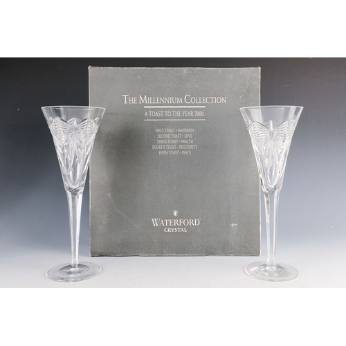 150 - A pair of Waterford crystal glass champagne flutes, boxed - together with four other champagne flute... 