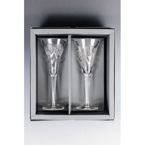 150 - A pair of Waterford crystal glass champagne flutes, boxed - together with four other champagne flute... 