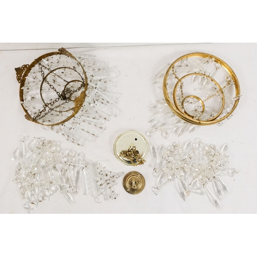 152 - A crystal chandelier, diameter 21cm - together with another crystal chandelier of similar proportion... 