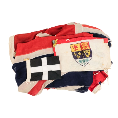 155 - Five various vintage flags - including two union flags, a red ensign, a British Empire Exhibition fl... 