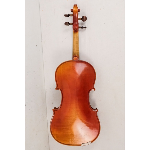 156 - A 20th century French violin - with a two piece back, together with two bows in a hard case with can... 