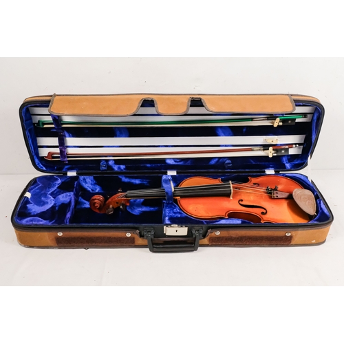 156 - A 20th century French violin - with a two piece back, together with two bows in a hard case with can... 