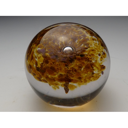 205 - A Wedgwood glass paperweight - set with an amber flower, 7cm diameter, together with four other simi... 