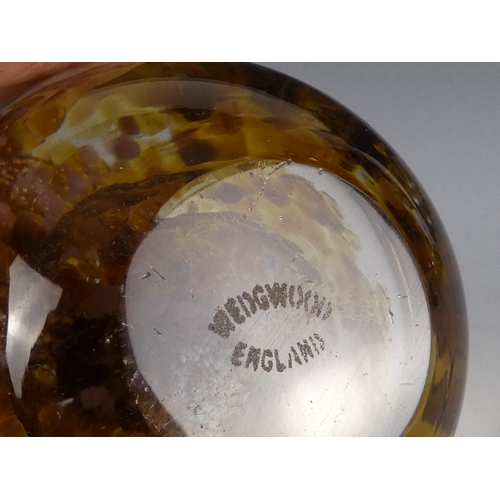 205 - A Wedgwood glass paperweight - set with an amber flower, 7cm diameter, together with four other simi... 