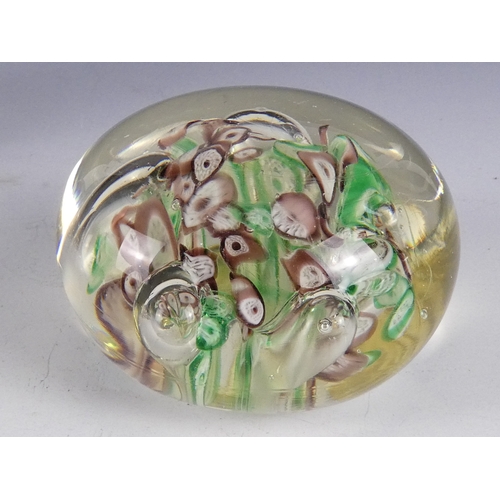 205 - A Wedgwood glass paperweight - set with an amber flower, 7cm diameter, together with four other simi... 