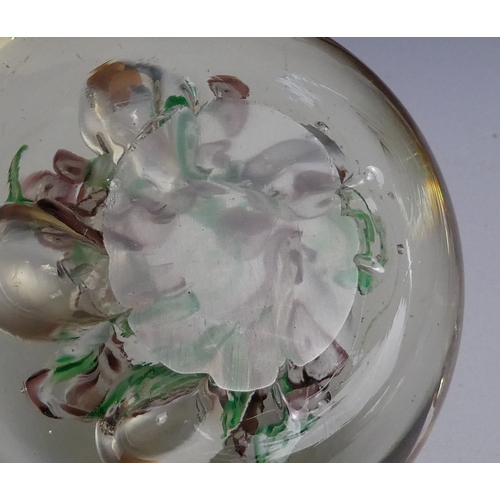 205 - A Wedgwood glass paperweight - set with an amber flower, 7cm diameter, together with four other simi... 